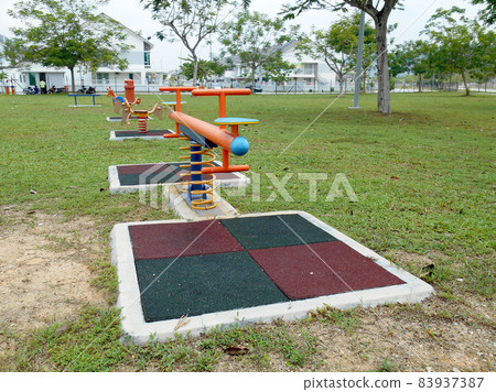 MALACCA, MALAYSIA -MAY 02, 2016: Children outdoor playground in the public park. It was design with few different themes and colorful to give different experience to the kids. MALACCA, MALAYSIA -MAY 02, 2016: Children outdoor playground in the public park. It was design with few different themes and colorful to give different experience to the kids. 83937387