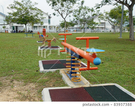 MALACCA, MALAYSIA -MAY 02, 2016: Children outdoor playground in the public park. It was design with few different themes and colorful to give different experience to the kids. MALACCA, MALAYSIA -MAY 02, 2016: Children outdoor playground in the public park. It was design with few different themes and colorful to give different experience to the kids. 83937388