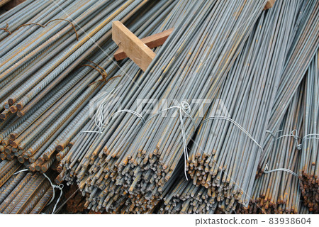 SELANGOR, MALAYSIA -MAY 13, 2016: Hot rolled deformed steel bars or steel reinforcement bars used at the construction site to strengthen concrete. It is shaped to follow the engineer's design. 83938604