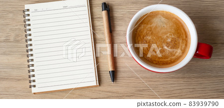 blank notebook and coffee cup on wood table. Motivation, Resolution, To do list, Strategy and Plan concept blank notebook and coffee cup on wood table. Motivation, Resolution, To do list, Strategy and Plan concept 83939790