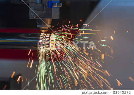 The fiber laser cutting machine cutting the stainless steel tube control by CNC program. 83940272