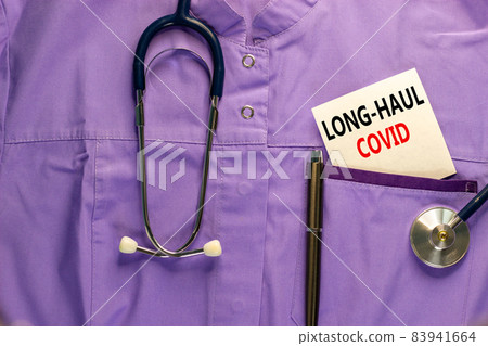 COVID-19 long-haul covid symptoms symbol. White card with words long-haul covid. Medical uniform, metalic pen and stethoscope. Medical, COVID-19 long-haul covid symptoms concept. COVID-19 long-haul covid symptoms symbol. White card with words long-haul covid. Medical uniform, metalic pen and stethoscope. Medical, COVID-19 long-haul covid symptoms concept. 83941664