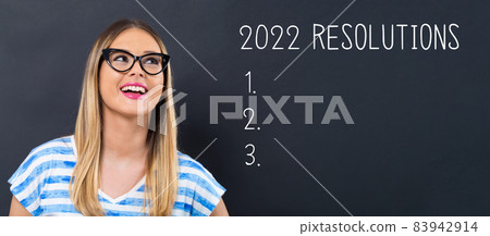 2022 Resolutions with happy young woman 83942914