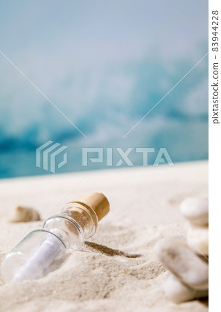 Summer sand sea beach with waves and glass botle with message Summer sand sea beach with waves and glass botle with message 83944228