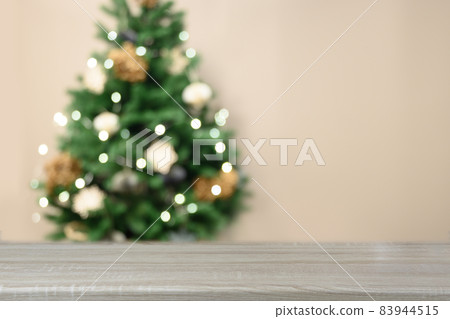 Empty tabletop and blurred christmas tree. Xmas background for display your products. Empty tabletop and blurred christmas tree. Xmas background for display your products. 83944515
