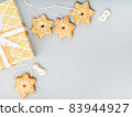 Gingerbread cookies and gift box Christmas background. 83944927