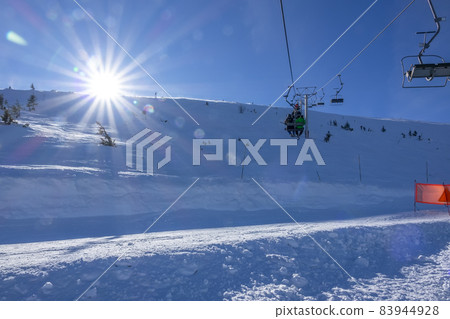 Bright Sun at Ski Resort and Chair Lift Bright Sun at Ski Resort and Chair Lift 83944928