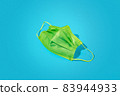 Bright and trendy green disposable mask. 83944933