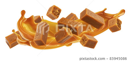 Caramel candies with caramel sauce splash isolated on white background Caramel candies with caramel sauce splash isolated on white background 83945086