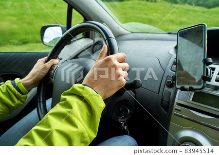 Man drive car. Mountain road. Responsible travel vacation. Staycation concept. Man drive car. Mountain road. Responsible travel vacation. Staycation concept. 83945514