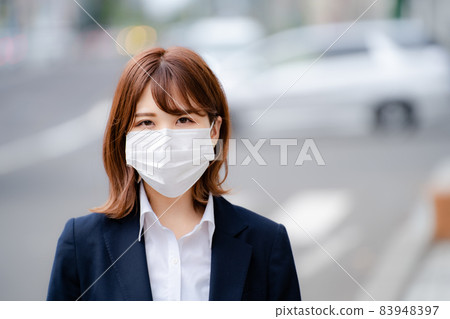 Business woman staring in a mask 83948397