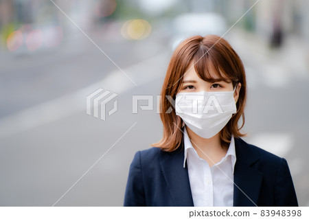 Business woman staring in a mask 83948398