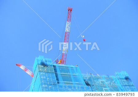 Construction site of a high-rise building using a crane Construction site of a high-rise building using a crane 83949793