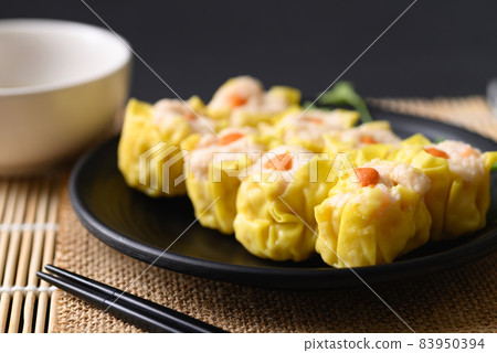 Shrimp shumai, Open-topped dumpling filled with chopped shrimp, Traditional Chinese steamed dumpling 83950394