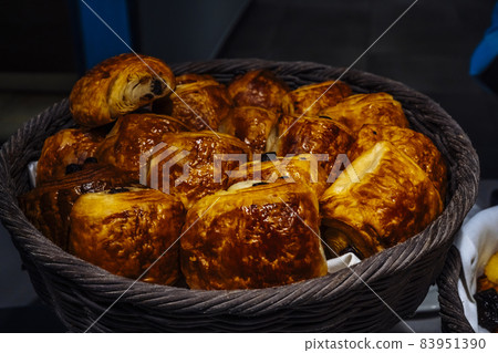 French pastries croissant with chocolate display into a hotel on the breakfast. French pastries croissant with chocolate display into a hotel on the breakfast. 83951390