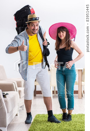 Young active pair preparing for honeymoon trip Young active pair preparing for honeymoon trip 83951445