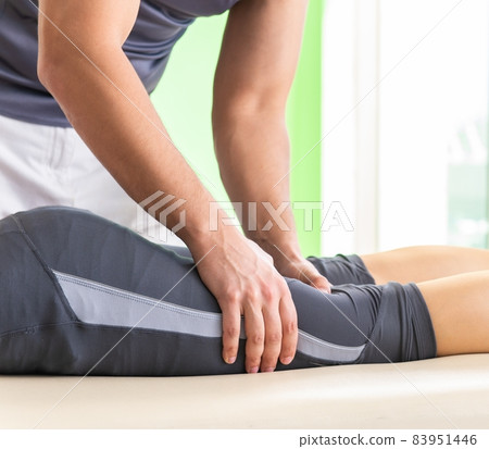 Young doctor chiropractor massaging patient 83951446