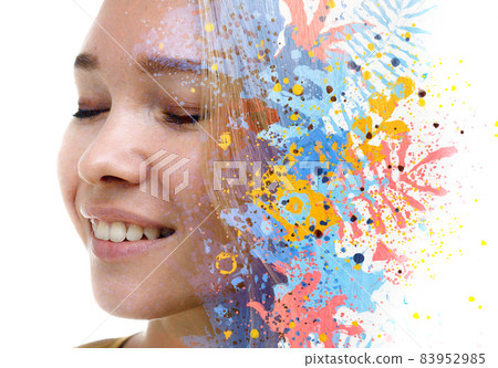 A portrait of a woman combined with colorful leaves in a double exposure technique. 83952985