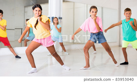 Portrait of group of boys and girls having dancing class in studio Portrait of group of boys and girls having dancing class in studio 83953040
