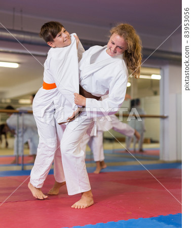 Girl in kimono exercising throws 83953056