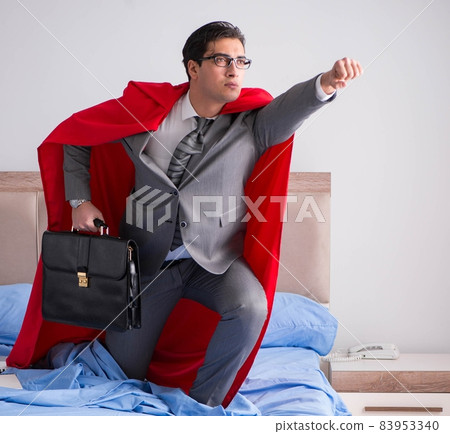 Super hero businesswoman working in bed 83953340