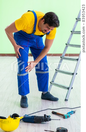 Injured worker at the work site Injured worker at the work site 83953423