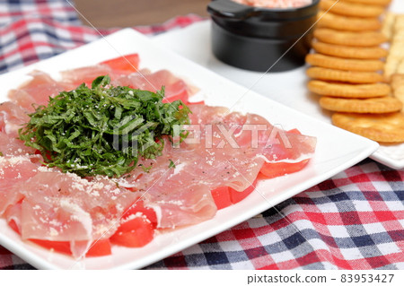Raw ham and tomato Raw ham and tomato 83953427