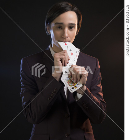 Young man showing tricks in the dark 83953518