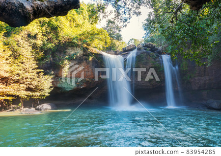 Beautiful waterfall with sunlight in jungle, Haew Suwat Waterfall at khao yai Nakhonratchasima province Beautiful waterfall with sunlight in jungle, Haew Suwat Waterfall at khao yai Nakhonratchasima province 83954285