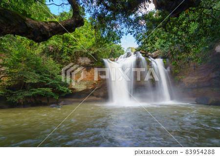 Beautiful waterfall with sunlight in jungle, Haew Suwat Waterfall at khao yai Nakhonratchasima province Beautiful waterfall with sunlight in jungle, Haew Suwat Waterfall at khao yai Nakhonratchasima province 83954288