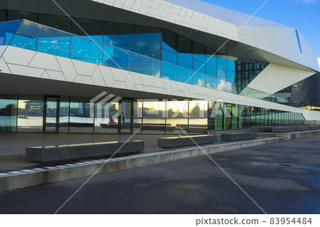 Amsterdam, Netherlands - Nov 30, 2019 : The futuristic building of the Eye Film Museum on the north shore of the harbor named Het IJ in Amsterdam, Netherlands on Nov 30, 2019. 83954484
