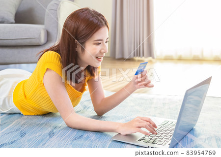 woman online shopping with credit 83954769