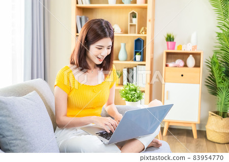 Asian young woman use laptop 83954770