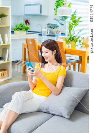 Asian woman using smartphone Asian woman using smartphone 83954771
