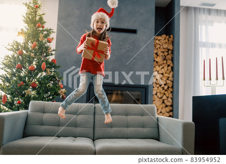girl with Christmas gift girl with Christmas gift 83954952