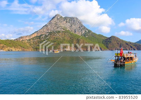 Yacht on the shore of the cozy bay of Adrasan, near Antalya and Kemer, Turkey Yacht on the shore of the cozy bay of Adrasan, near Antalya and Kemer, Turkey 83955520