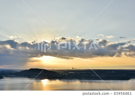 The morning sun shines from behind the clouds The morning sun shines from behind the clouds 83956861