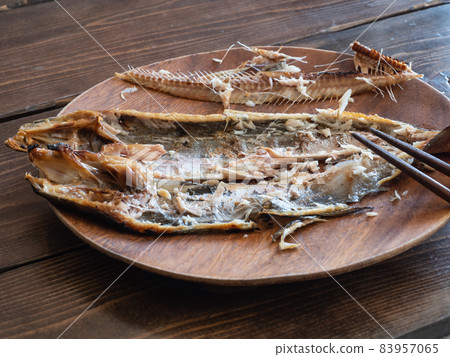 Grilled fish atka mackerel. Atka mackerel skin and bones after eating. Grilled fish atka mackerel. Atka mackerel skin and bones after eating. 83957065