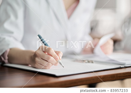 Hands of medical personnel attending the seminar Hands of medical personnel attending the seminar 83957233