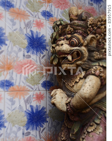 Bali fashionable walls and stone statues 83957915