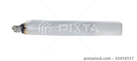 Burning cigarette isolated on white background close up Burning cigarette isolated on white background close up 83958557