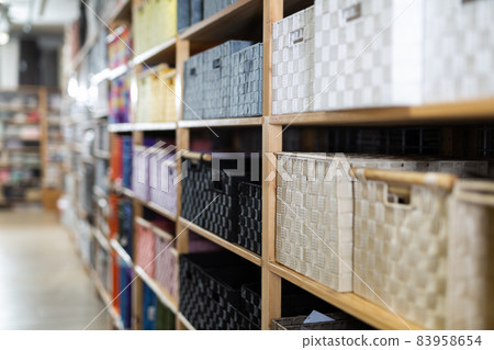 Decorative storage boxes on shelving in household goods store Decorative storage boxes on shelving in household goods store 83958654