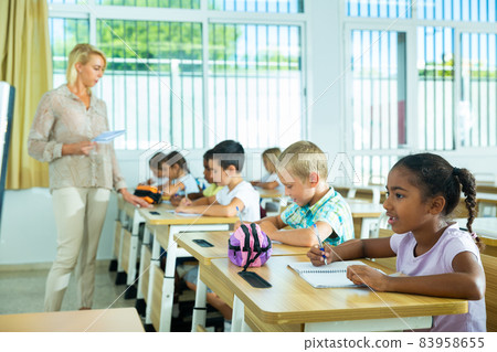 Side view of group of elementary school students Side view of group of elementary school students 83958655