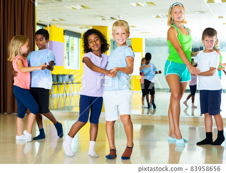Tweens in pairs learning to dance waltz Tweens in pairs learning to dance waltz 83958656