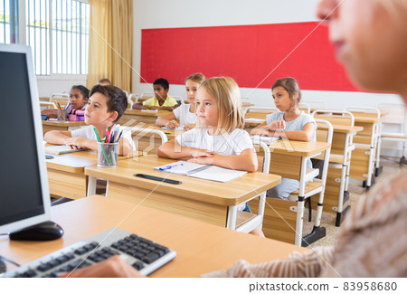 Group of focused children working at class 83958680