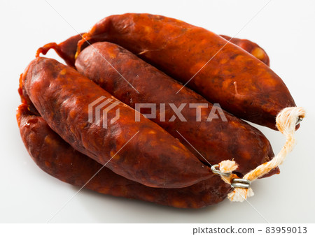 Sausages chorizo on white surface 83959013