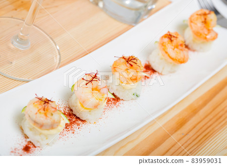 Grilled shrimps on rice with lime and saffron Grilled shrimps on rice with lime and saffron 83959031