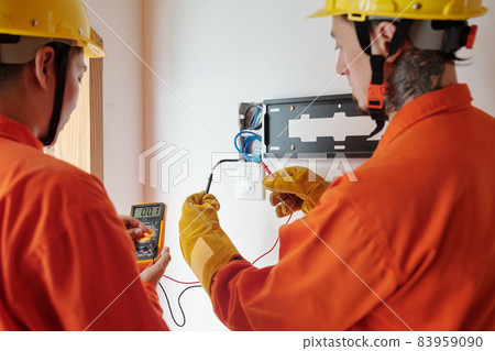 Electricians Testing Electrical Wires Electricians Testing Electrical Wires 83959090