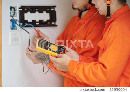 Electricians Fixing Wiring in House 83959094