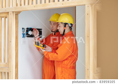 Electricicans Checking Power in House Electricicans Checking Power in House 83959105